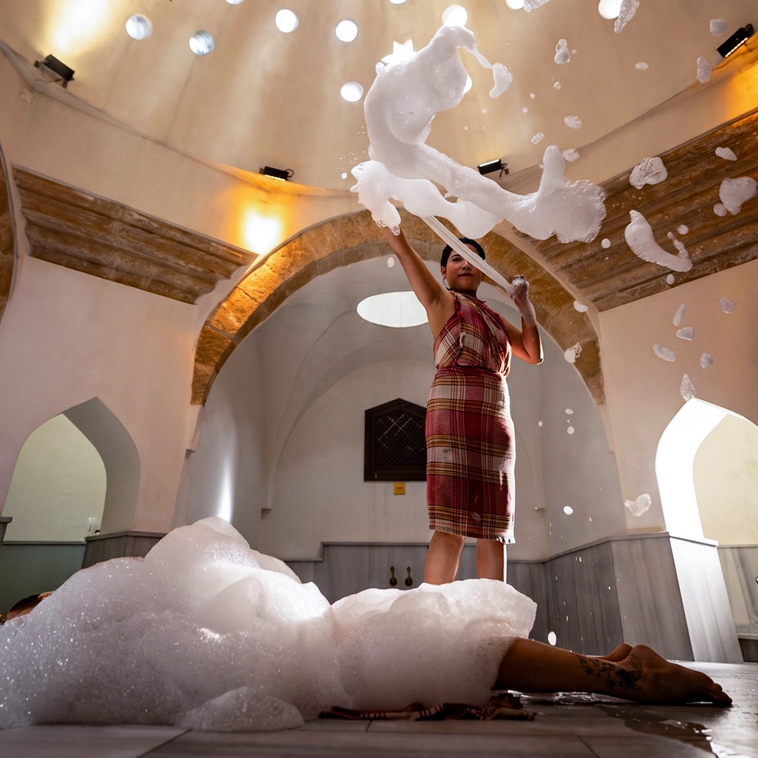 Traditional water rinse during the Pir-u Pak ritual at Ürgüp Hamam